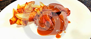 Veal mucles, with Peppers saune and Baked potatoes. photo