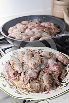 Veal rolls with bacon, cheese and plum