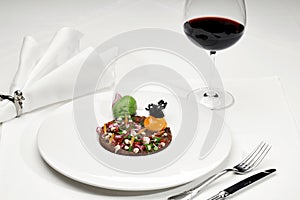 Veal tartar and wine in a restaurant