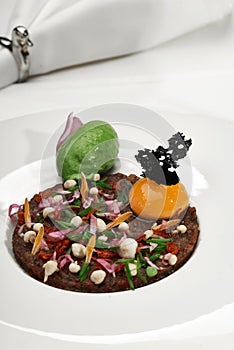 Veal tartar and wine in a restaurant