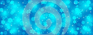 Vector Abstract Falling Snowflakes, Glittering Sparkles and Blurry Bokeh in Blue Background Banner