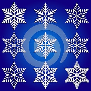 Vector abstract set of white snowflakes on blue