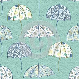 Vector Blue, Green, Yellow Printed Umbrellas on Aqua Green Background Seamless Repeat Pattern. Background for textiles