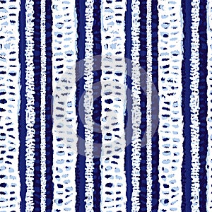 Vector blue shibori monochrome vertical grunge stripes seamless pattern. Suitable for textile, gift wrap and wallpaper.