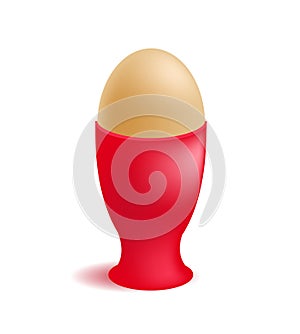 Vector brown egg in red eggcup for breakfast photo