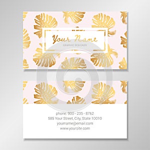 Vector business card template with golden monstera palm leaves on pale pink background.