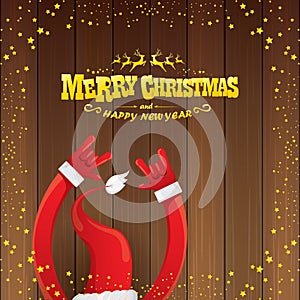 Vector cartoon Santa Claus rock n roll style with golden calligraphic greeting text on wooden background with christmas