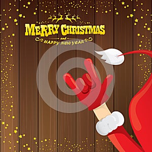 Vector cartoon Santa Claus rock n roll style with golden calligraphic greeting text on wooden background with christmas