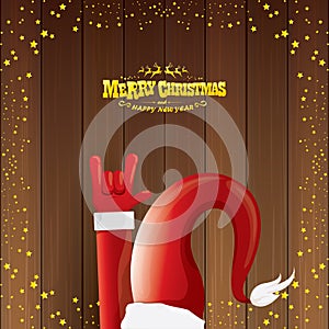 Vector cartoon Santa Claus rock n roll style with golden calligraphic greeting text on wooden background with christmas