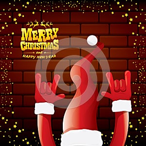 Vector cartoon Santa Claus rock n roll style with golden greeting text on brick wall background with christmas star