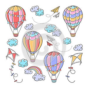 Cartoon set with hot air balloons, kites, paper planes, clouds and rainbow on white background