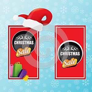 Vector Christmas sales paper banner or tag label with red santa hat on snowy blue background with falling snowflakes