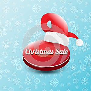 Vector Christmas sales paper banner or tag label with red santa hat on snowy blue background with falling snowflakes