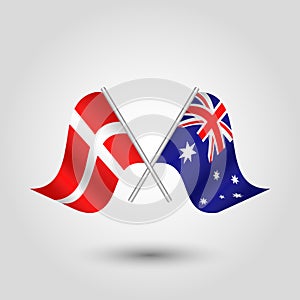 Vector crossed danish and australian flags on silver sticks - symbol of denmark and australia