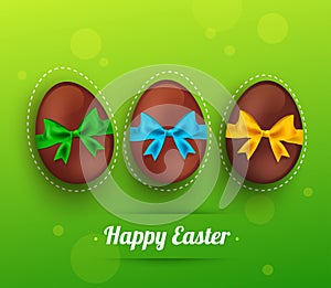 Vector easter chocolate egg with ribbon on green