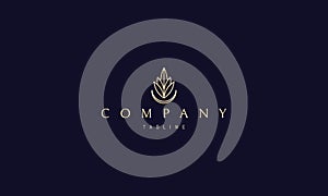 Vector golden logo on which an abstract image of leaves and the moon that form the silhouette of a drop.