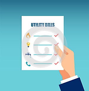 Vector of a hand holding sheet with utility bills photo