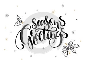 Vector hand lettering christmas greetings text - season`s greetings - with holly leaves and snowflakes