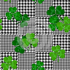 Vector houndstooth seamless black and white pattern with green shamrocks