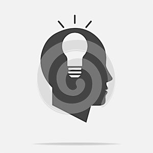 Vector icon of a man's head with an idea. A man thinks on a gray