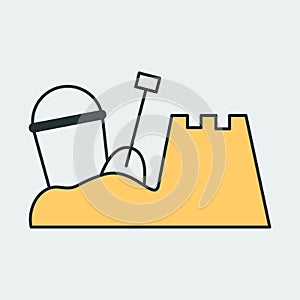 Vector icon of a sandbox with bucket, spatula and built fortress. It represents a concept of summer, fun, beach and family