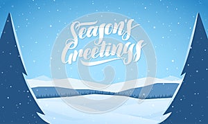 Blue mountains winter snowy landscape with hand lettering of Seasons Greetings and pines on foreground