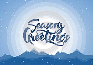 Vector illustration. Blue winter mountains background with hand lettering of Season`s Greetings