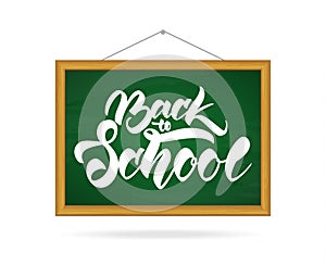 Vector illustration: Chalkboard with Hand lettering of Back to School.