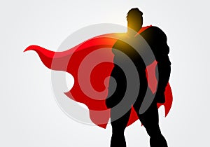 Vector Illustration Silhouette of a Superhero with red cape posing photo