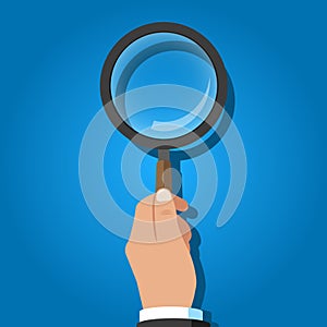 Vector Illustration of a magnifying glass in hand.