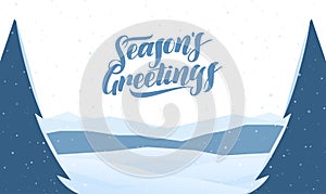 Mountains winter snowy landscape with hand lettering of Seasons Greetings and pines on foreground