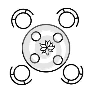 Round table with decorative centerpiece and chairs photo