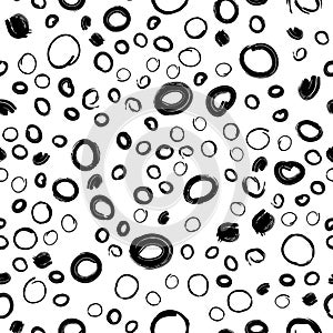 Vector illustration of seamless black dot pattern with different grunge effect rounded spots