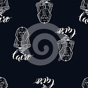 Seamless pattern with Cairo label with hand drawn Sphinx, lettering Cairo on dark blue background