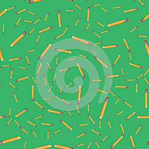 Seamless pattern pencils on a green background