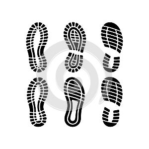 Black and white vector illustration of various shoe prints footprints on white background