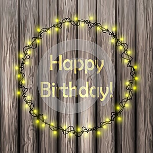 Vector llustration Happy Birthday concept. Illuminated garland on a wooden background. Glowing greeting card. Design