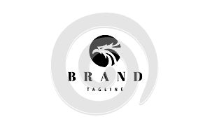Vector logo on which an abstract image of the head of an eagle in a circle.