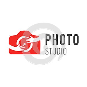 Vector logo for photographer. Vector logo design photo camera symbol with hands. Hugging photo camera symbol. Hug camera