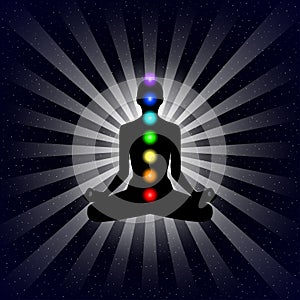 Vector meditation design concept. Silhouette in lotus position with seven chakras over night sky background.