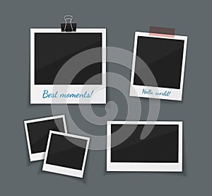 Vector photo frames sticked with tape and hanged on paper clip. Retro fotos. Dark background.