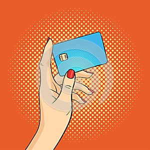 Vector pop art illustration of hand holding credit card