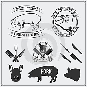 Vector pork meat labels and design elements. Butcher`s business logos. Silhouettes of pig and cutlery.