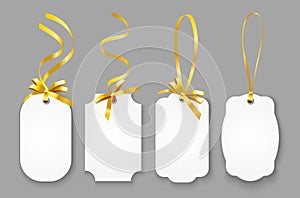 Vector realistic set of blank paper name tags or coupons with gold ribbons isolated on grey background