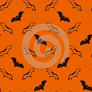 Vector seamless background for Halloween design with hand drawn flying bats on orange background