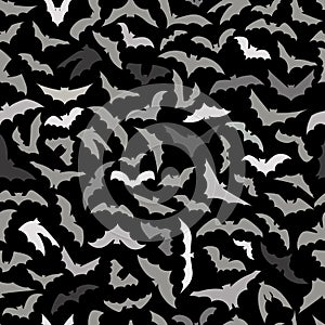 Vector seamless background for Halloween design. Seamless pattern with gray flying bats isolated on black background