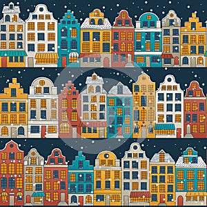 Vector seamless background with a winter European town. Hand drawn colorful houses with falling snow.
