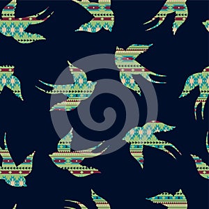 Vector seamless colorful decorative ethnic pattern with swallows