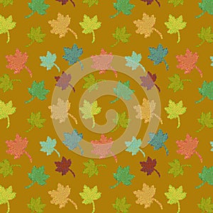 Vector seamless pattern of autumn leaves over golden background