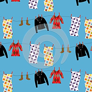Vector seamless pattern with clothes in laundry isolated on blue background
